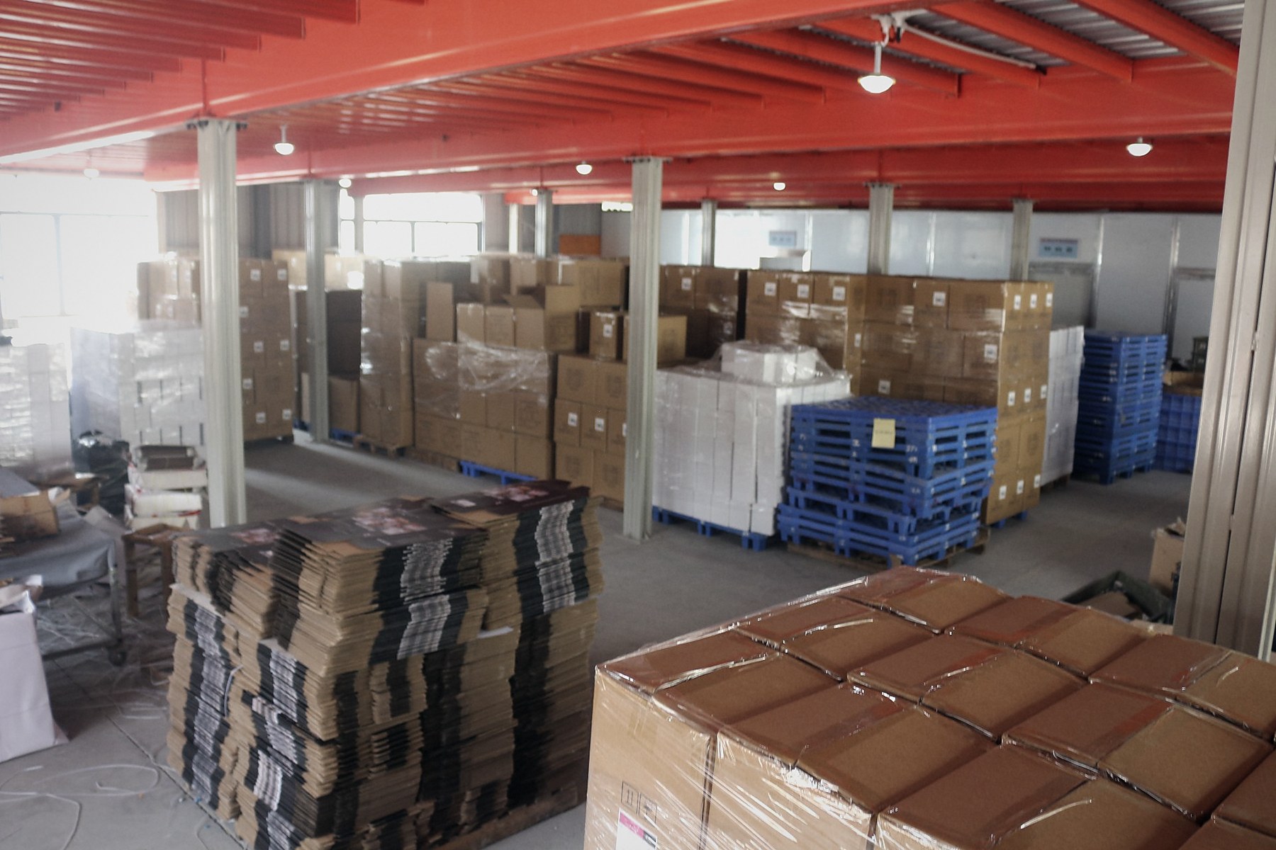 Finished cartons palletised in the dispatch warehouse